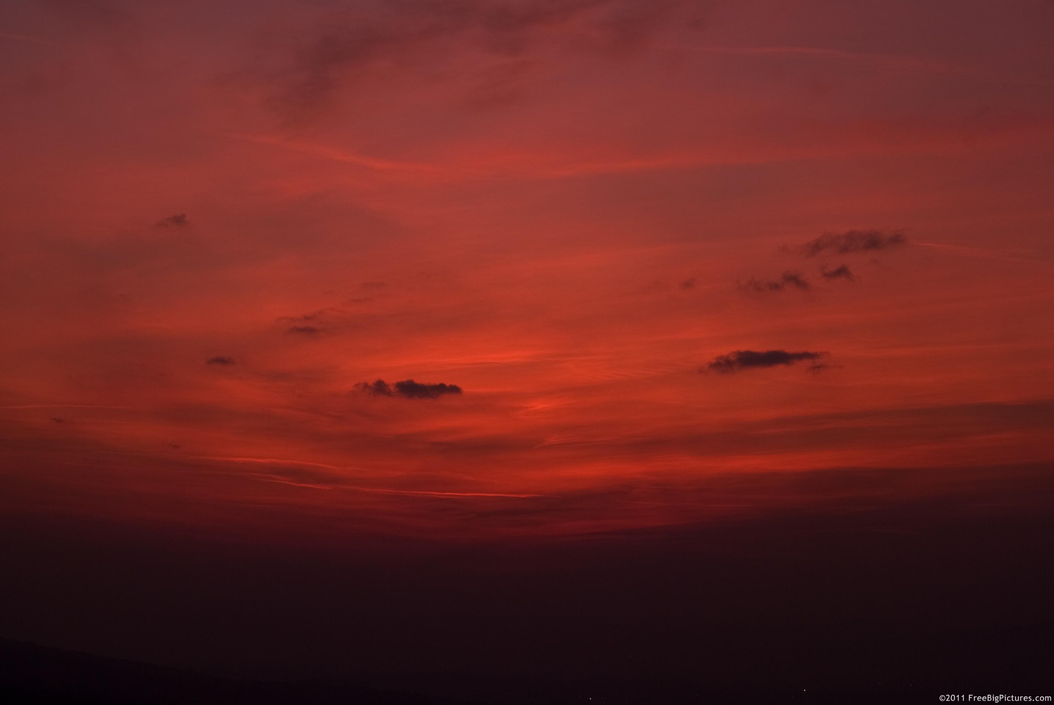 Sky with reddish hues after sunset