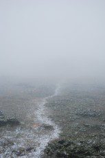 Mountain trail with a snowy layer